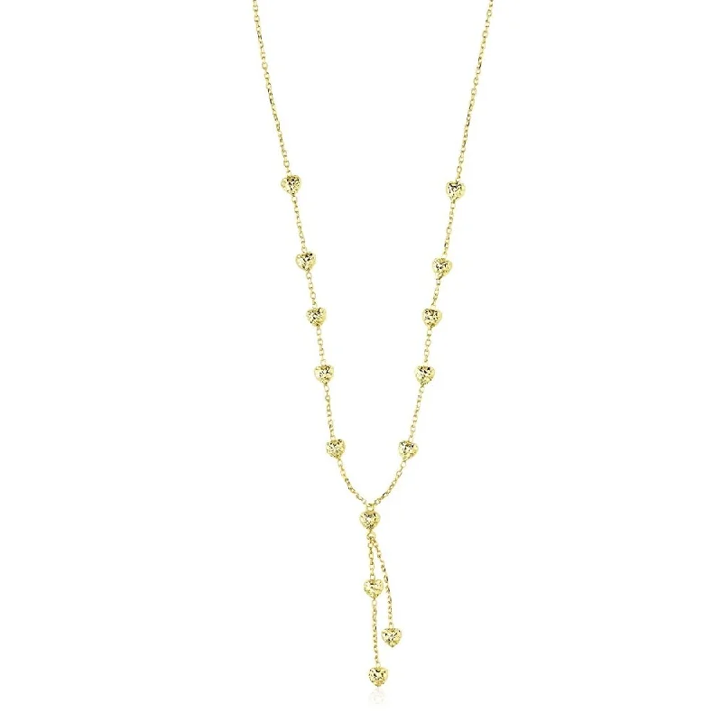 Worn medallion necklaces-14k Yellow Gold Puffed Heart Station Diamond Cut Lariat Style Necklace